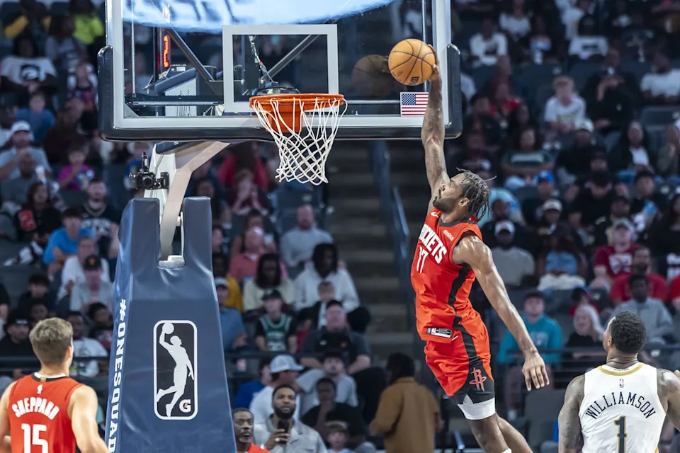 Oct 14, 2025; Birmingham, Alabama, USA; Houston Rockets forward Tari Eason (17) dunks on the New Orleans Pelicans during an NBA preseason game at Legacy Arena at BJCC. Mandatory Credit: Vasha Hunt-Imagn Images