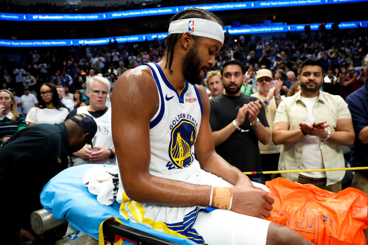 Golden State Warriors guard Moses Moody (4) leaves the court on a stretcher during overtime against the Dallas Mavericks at American Airlines Center.Kevin Jairaj-Imagn Images