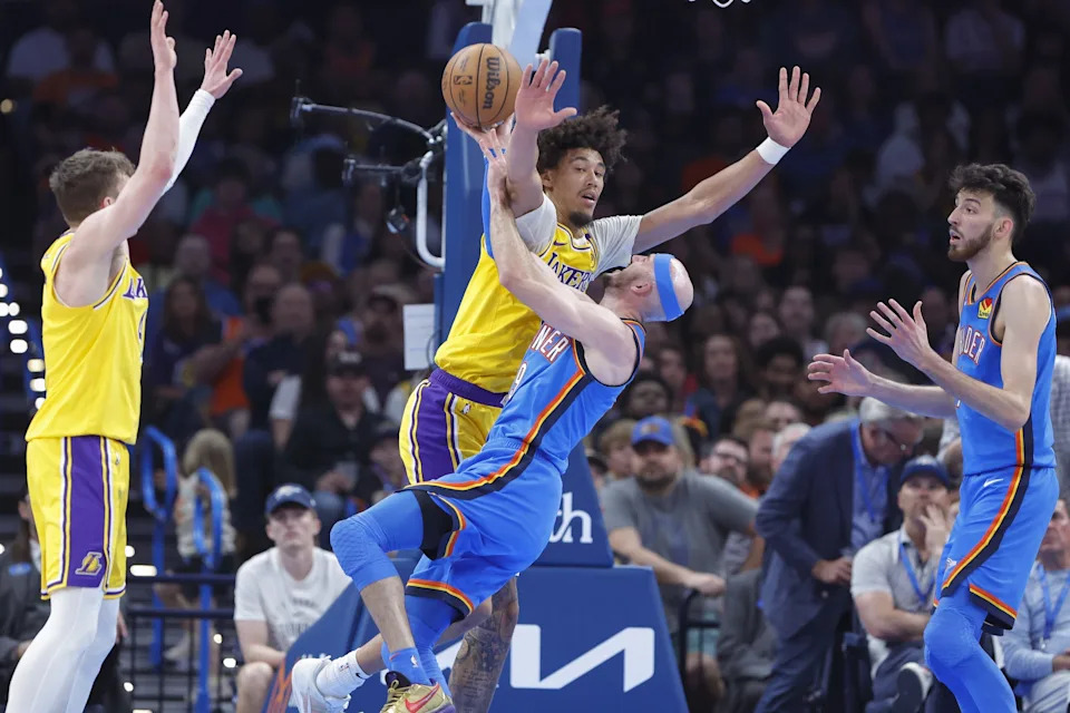Apr 8, 2025; Oklahoma City, Oklahoma, USA; Los Angeles Lakers center Jaxson Hayes (11) and Oklahoma City Thunder guard Alex Caruso (9) get tangled up during a play during the second quarter at Paycom Center. Mandatory Credit: Alonzo Adams-Imagn Images