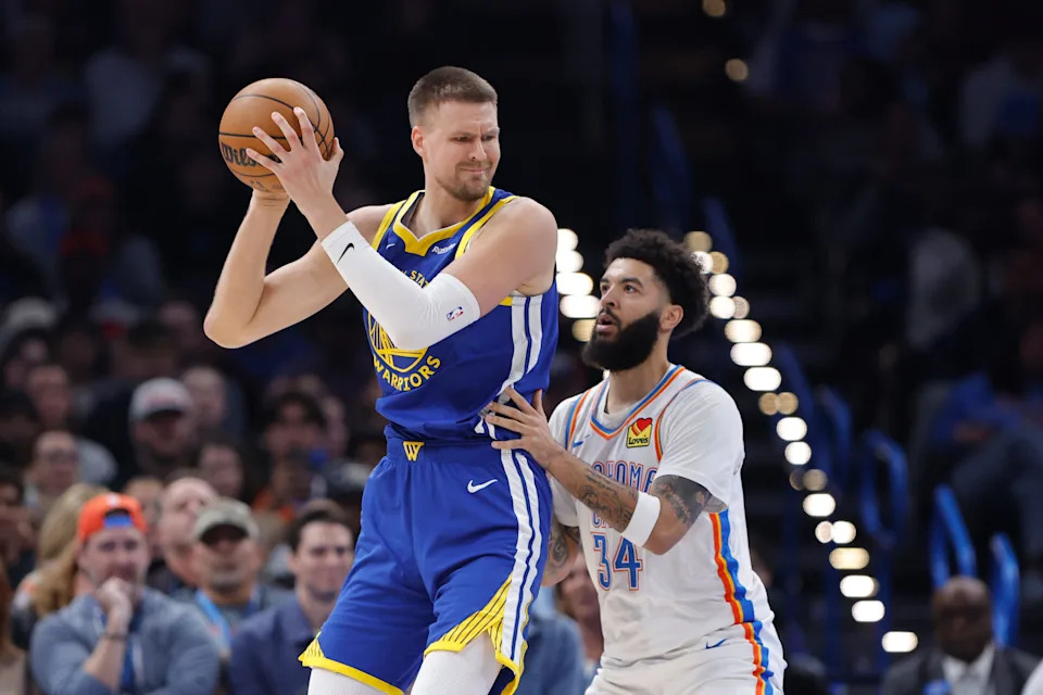 Mar 7, 2026; Oklahoma City, Oklahoma, USA; Golden State Warriors forward/center Kristaps Porziņģis (7) moves the ball against Oklahoma City Thunder guard/forward Kenrich Williams (34) during the first half at Paycom Center. Mandatory Credit: Alonzo Adams-Imagn Images