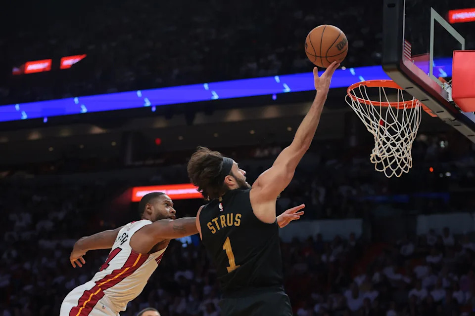 Apr 28, 2025; Miami, Florida, USA; Cleveland Cavaliers guard Max Strus (1) drives to the basket past Miami Heat forward Haywood Highsmith (24) in the second quarter during game four for the first round of the 2025 NBA Playoffs at Kaseya Center. Mandatory Credit: Sam Navarro-Imagn Images