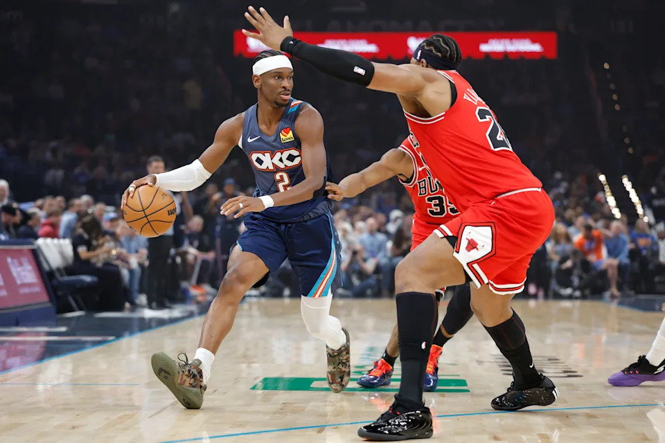 Mar 27, 2026; Oklahoma City, Oklahoma, USA; Oklahoma City Thunder guard Shai Gilgeous-Alexander (2) drives around Chicago Bulls forward Isaac Okoro (35) and forward Guerschon Yabusele (28) during the first quarter at Paycom Center. Mandatory Credit: Alonzo Adams-Imagn Images