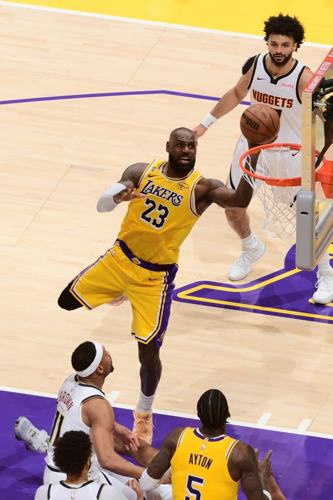 LeBron James of the Los Angeles Lakers shoots the ball during the game against the Denver Nuggets on March 14, 2026 at Crypto.Com Arena in Los Angeles, California. (Photo by Adam Pantozzi/NBAE via Getty Images) NBAE via Getty Images