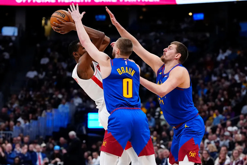 Mar 11, 2026; Denver, Colorado, USA; Denver Nuggets guard Christian Braun (0) and center Nikola Jokic (15) defend on Houston Rockets forward Kevin Durant (7) in the second quarter at Ball Arena. Mandatory Credit: Ron Chenoy-Imagn Images