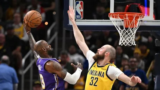 Los Angeles Lakers forward LeBron James (23) dunks the ball past Indiana Pacers center Jay Huff (32) during the second quarter at Gainbridge Fieldhouse.