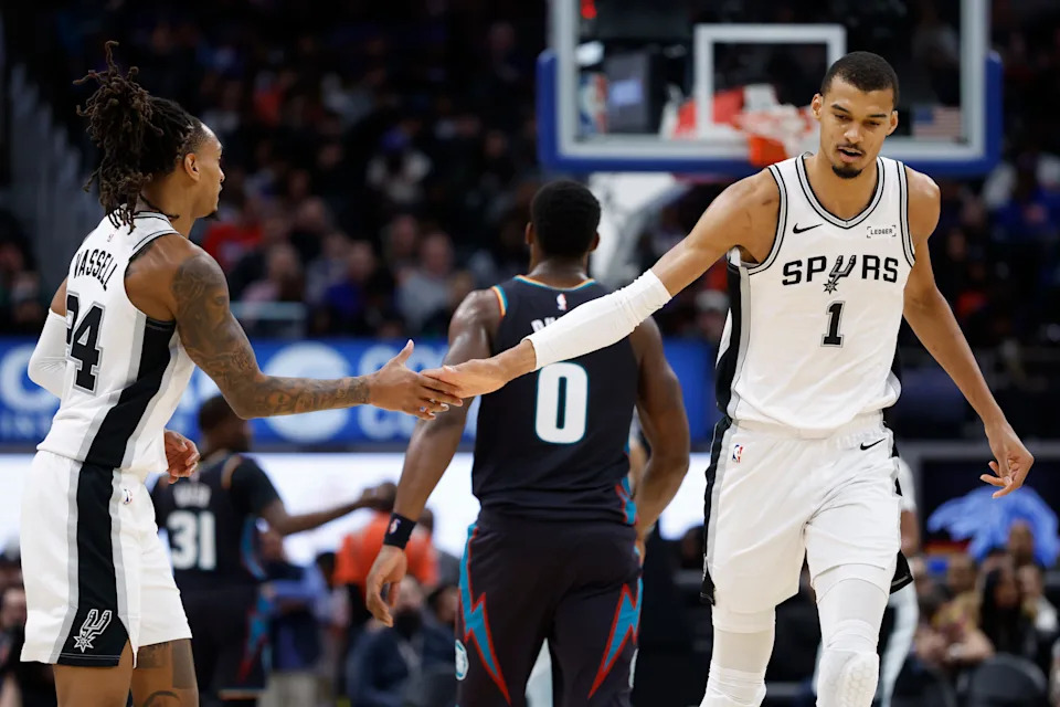 Feb 23, 2026; Detroit, Michigan, USA; San Antonio Spurs forward Victor Wembanyama (1) receives congratulations from guard Devin Vassell (24) in the second half against the Detroit Pistons at Little Caesars Arena. Mandatory Credit: Rick Osentoski-Imagn Images