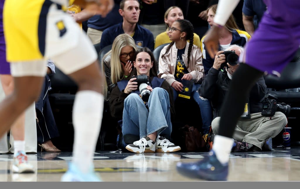 The Fever guard worked as a credentialed photographer for the Pacers during their 137-130 loss to the Lakers. Getty Images