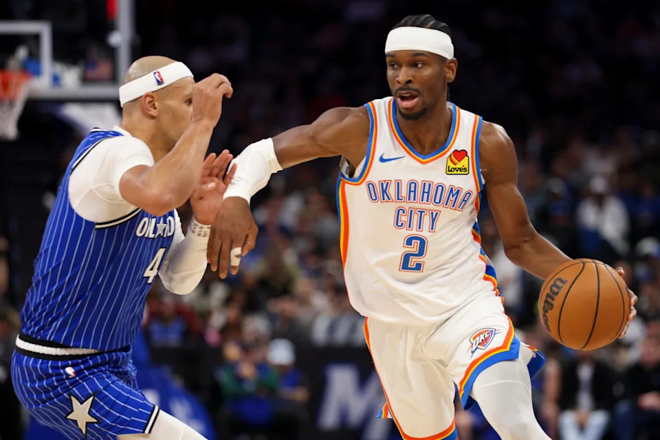 aMar 17, 2026; Orlando, Florida, USA; Oklahoma City Thunder guard Shai Gilgeous-Alexander (2) drives to the basket past Orlando Magic guard Jalen Suggs (4) in the third quarter at Kia Center. Mandatory Credit: Nathan Ray Seebeck-Imagn Images