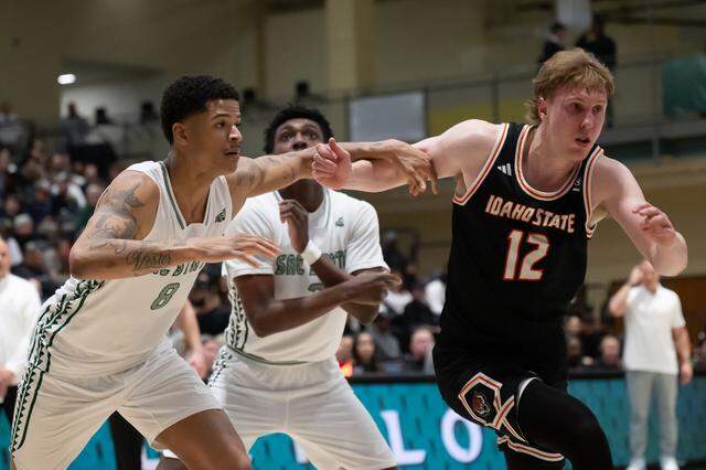 Sacramento State Hornets forward Shaqir O'Neal (8) and Idaho State Bengals guard Lachlan Brewer (12) battle for rebound during a game at Sacramento State on Monday, March 2, 2026.