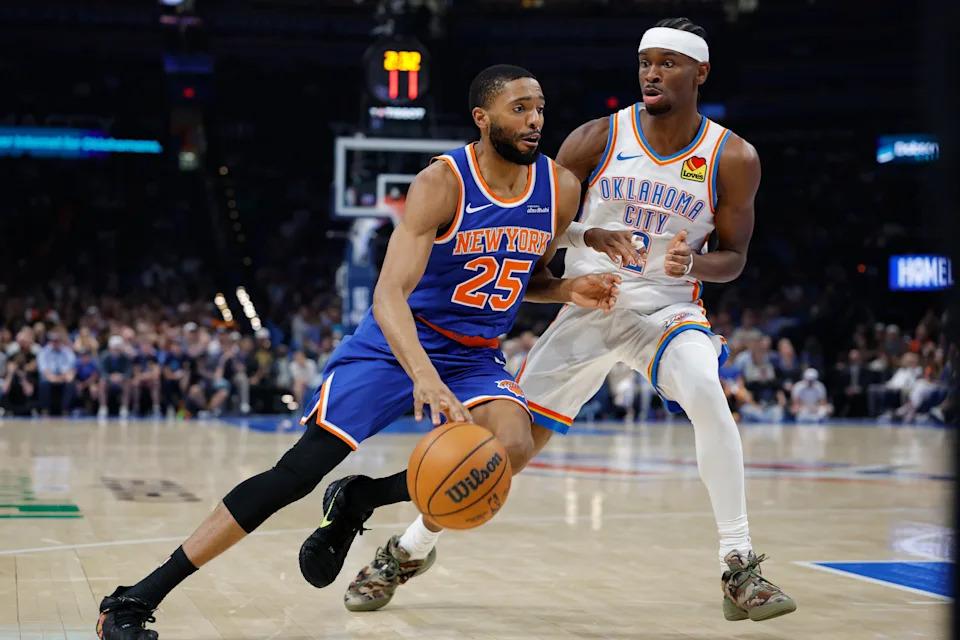 Mar 29, 2026; Oklahoma City, Oklahoma, USA; New York Knicks guard Mikal Bridges (25) drives around Oklahoma City Thunder guard Shai Gilgeous-Alexander (2) during the first half at Paycom Center. Mandatory Credit: Alonzo Adams-Imagn Images