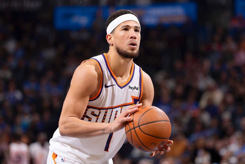 Devin Booker of the Phoenix Suns makes a free throw during the game against the Oklahoma City Thunder during the 2025 - 2026 Emirates Cup game.