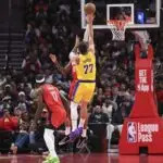 Los Angeles Lakers guard Luka Doncic (77) shoots the ball as Houston Rockets forward Jabari Smith Jr. (10) defends during the first quarter at Toyota Center.