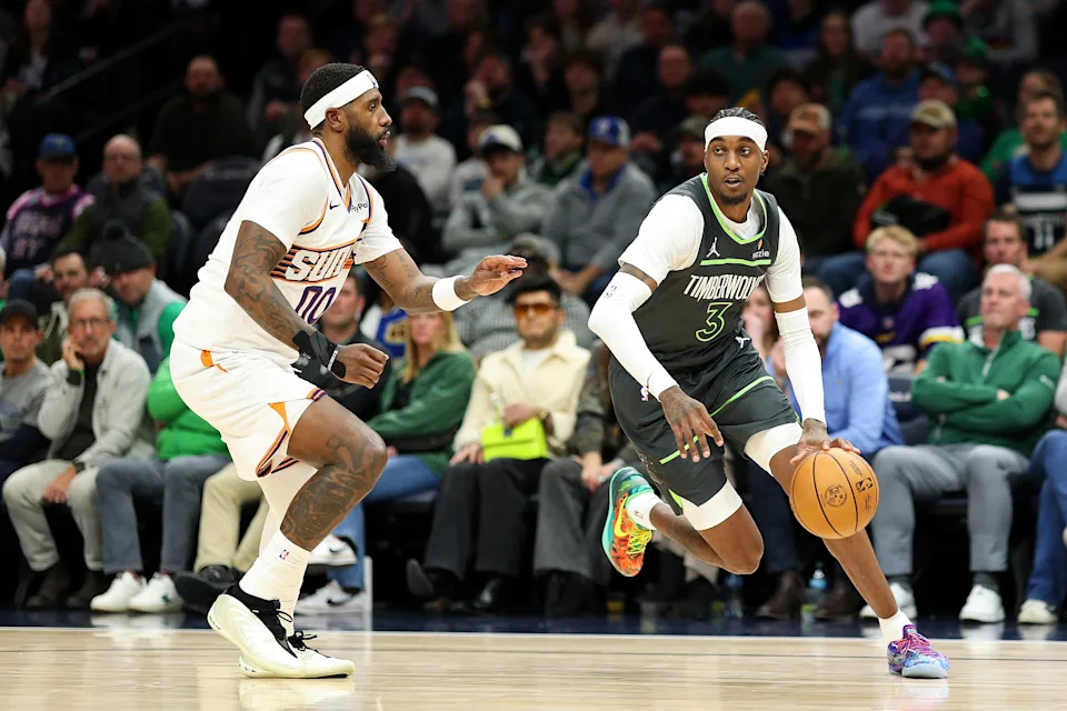 MINNEAPOLIS, MINNESOTA – MARCH 17: Jaden McDaniels #3 of the Minnesota Timberwolves goes to the basket against Royce O'Neale #00 of the Phoenix Suns in the fourth quarter at Target Center on March 17, 2026 in Minneapolis, Minnesota. The Timberwolves defeated the Suns 116-104. NOTE TO USER: User expressly acknowledges and agrees that, by downloading and or using this photograph, User is consenting to the terms and conditions of the Getty Images License Agreement. (Photo by David Berding/Getty Images) | Getty Images