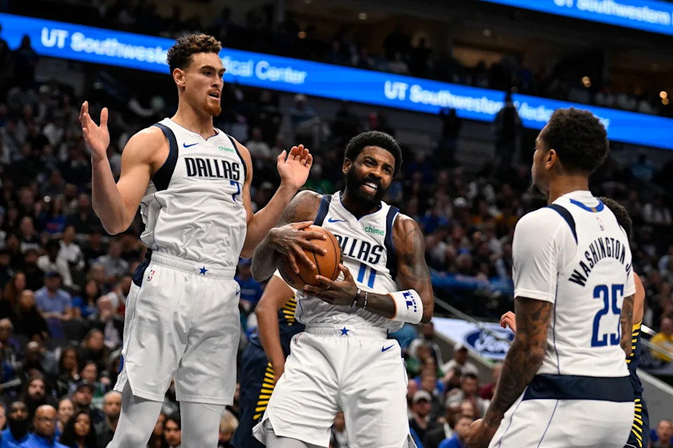 Dallas Mavericks center Dwight Powell (7), guard Kyrie Irving (11), and forward P.J. Washington (25).Jerome Miron-Imagn Images