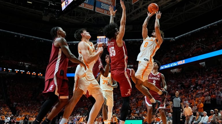 Tennessee guard Ja'kobi Gillespie (0) shoots the ball over Alabama...