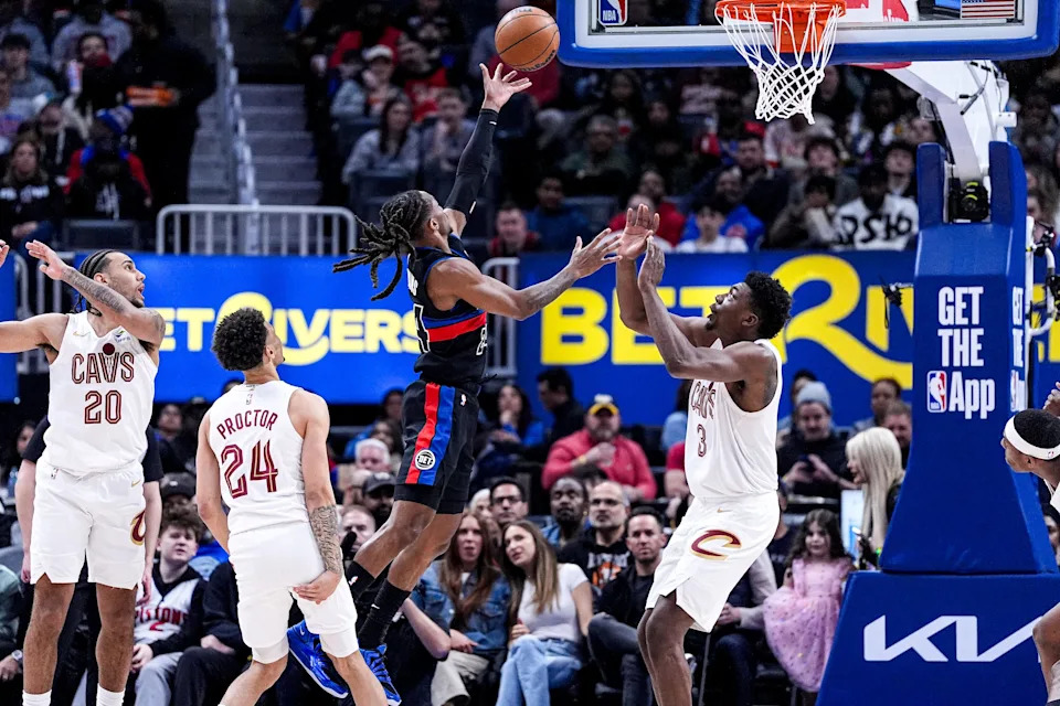 Detroit Pistons guard Daniss Jenkins (24) goes to the basket against Cleveland Cavaliers center Thomas Bryant (3) during the first half at Little Caesars Arena in Detroit on Friday, Feb. 27, 2026.