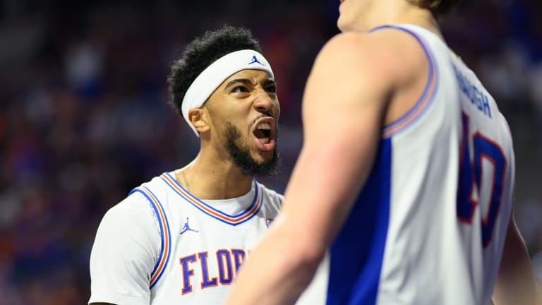 Florida guard Boogie Fland, left, screams at forward Thomas Haugh,...