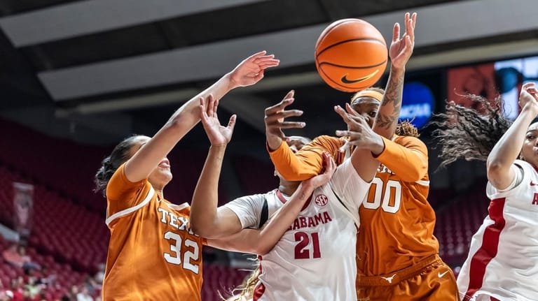 Texas forward Teya Sidberry (32) and center Kyla Oldacre (00)...