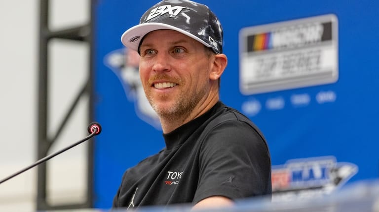 23XI Racing's team co-owner Denny Hamlin speaks to media follow...