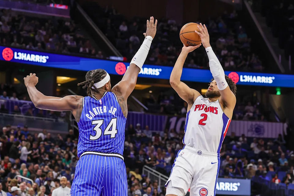 Detroit Pistons guard Cade Cunningham (2) shoots against Orlando Magic center Wendell Carter Jr. (34) during the first quarter at Kia Center in Orlando, Florida, on Sunday, March 1, 2026.