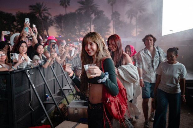 Lisa of Blackpink is spotted in the photo pit ahead of Jennie's solo set on the Outdoor Stage during Weekend One of the Coachella Valley Music and Arts Festival in Indio on Sunday, April 13, 2025. (Photo by Watchara Phomicinda, Contributing Photographer)