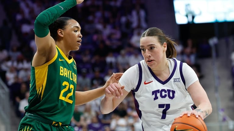TCU forward Marta Suárez drives to the basket against Baylor...