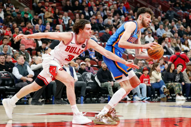 Mar 3, 2026; Chicago, Illinois, USA; Chicago Bulls guard Josh Giddey (3) defends against Oklahoma City Thunder center Chet Holmgren (7)during the first half at United Center. Mandatory Credit: Kamil Krzaczynski-Imagn Images