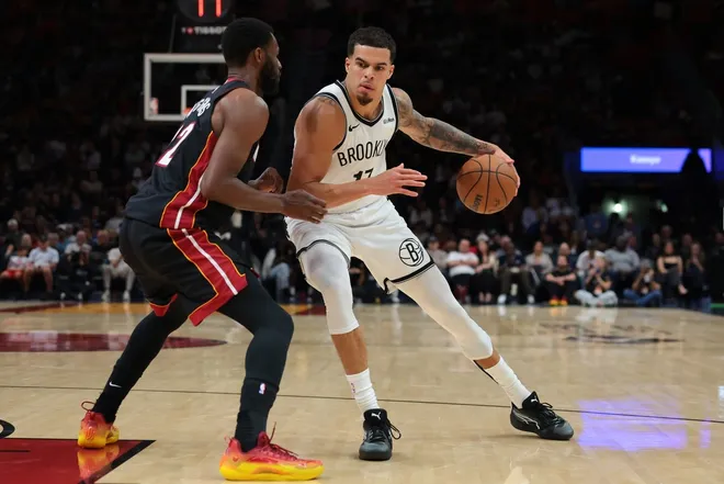 Mar 3, 2026; Miami, Florida, USA; Brooklyn Nets forward Michael Porter Jr. (17) drives to the basket against Miami Heat forward Andrew Wiggins (22) during the second quarter at Kaseya Center.