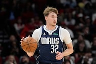 Dallas Mavericks forward Cooper Flagg (32) dribbles against the Houston Rockets during the...
