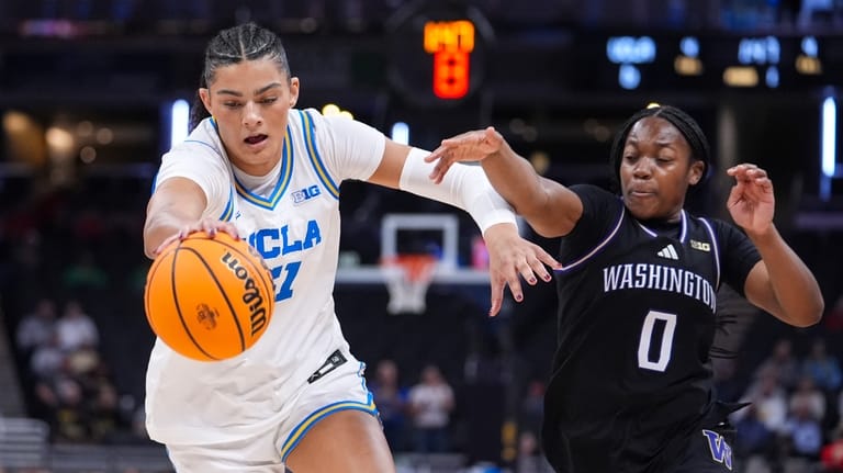 UCLA center Lauren Betts (51) steals the ball from Washington...