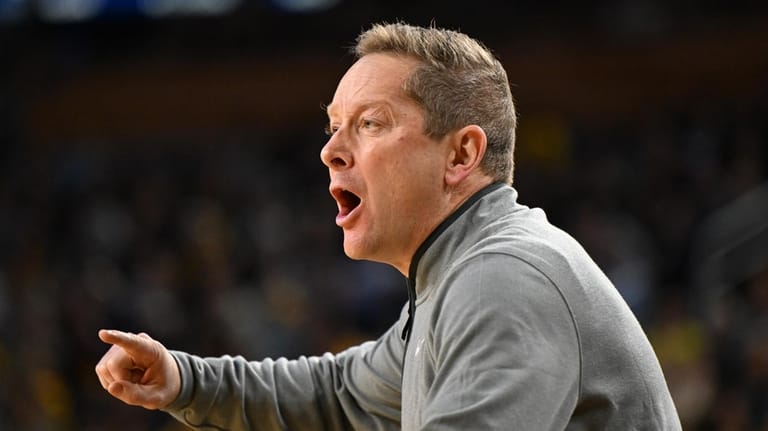 Minnesota head coach Niko Medved yells instructions to his team...