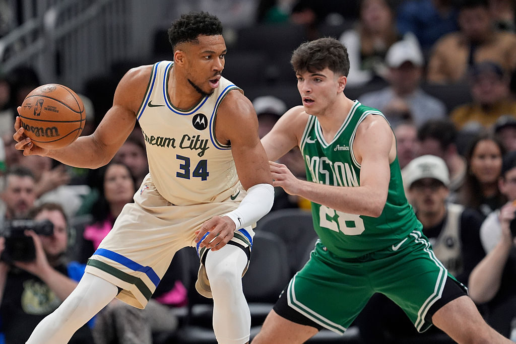 MILWAUKEE, WISCONSIN - MARCH 02: Giannis Antetokounmpo #34 of the Milwaukee Bucks dribbles the ball against Hugo González #28 of the Boston Celtics during the third quarter at Fiserv Forum on March 02, 2026 in Milwaukee, Wisconsin.