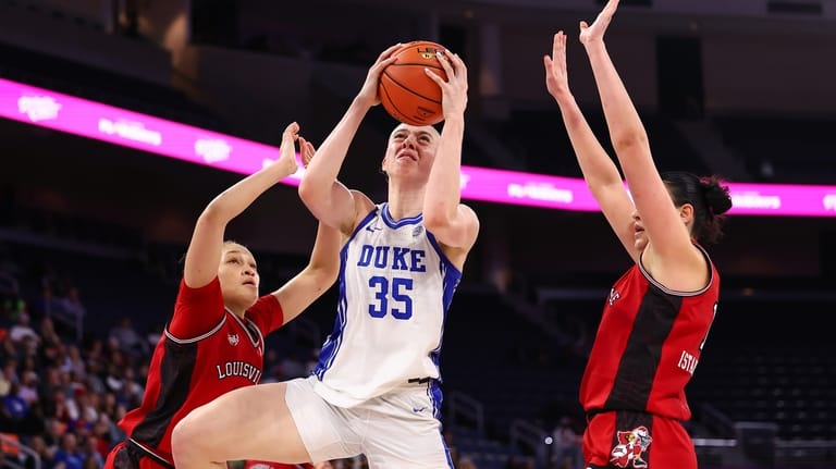 Duke forward Toby Fournier (35) shoots against Louisville guard Imari...