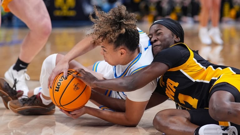Iowa guard Taylor Stremlow (1) and UCLA guard Kiki Rice...