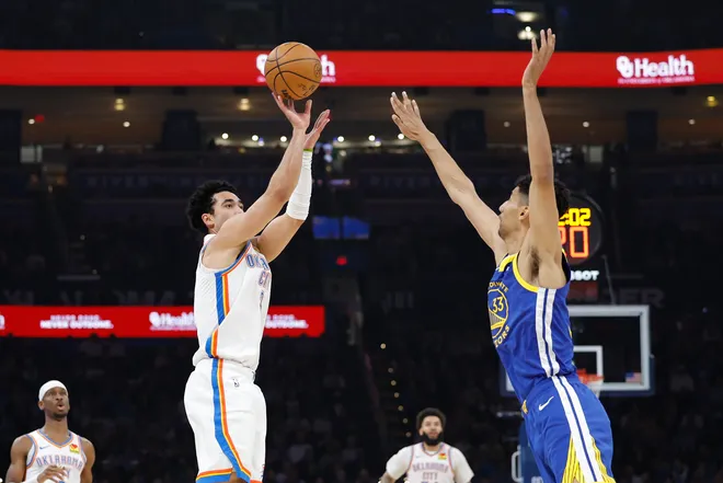 Mar 7, 2026; Oklahoma City, Oklahoma, USA; Oklahoma City Thunder guard Jared McCain (3) shoots a three point basket as Golden State Warriors forward Malevy Leons (33) defends during the first half at Paycom Center. Mandatory Credit: Alonzo Adams-Imagn Images