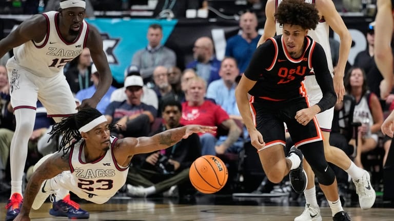 Oregon State forward Isaiah Sy (13) and Gonzaga guard Adam...