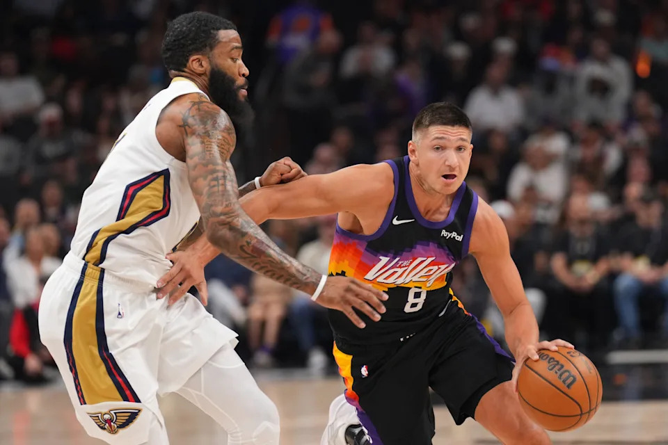 Phoenix Suns guard Grayson Allen (8) dribbles against New Orleans Pelicans guard Saddiq Bey (41) during the first half at Mortgage Matchup Center in Phoenix, on March 6, 2026.