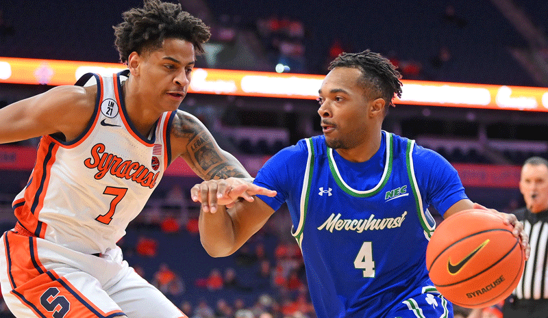 Mercyhurst Lakers guard Bernie Blunt (4) drives against Syracuse Orange guard Kiyan Anthony.