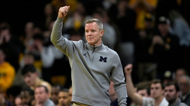 Michigan head coach Dusty May directs his team during the...