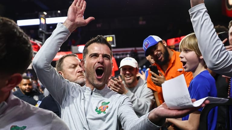 Florida head coach Todd Golden reacts after an NCAA college...