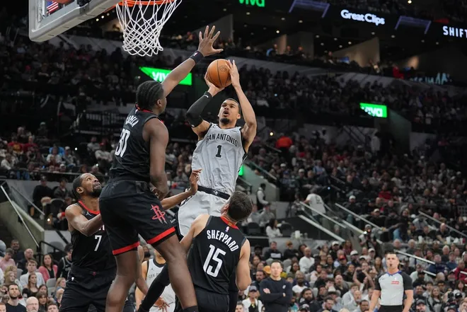 Mar 8, 2026; San Antonio, Texas, USA; San Antonio Spurs forward Victor Wembanyama (1) shoots over Houston Rockets forward Kevin Durant (7), center Clint Capela (30), and guard Reed Sheppard (15) in the second half at Frost Bank Center.