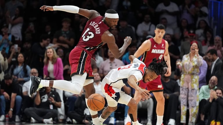 Miami Heat center Bam Adebayo clashes with Washington Wizards guard...
