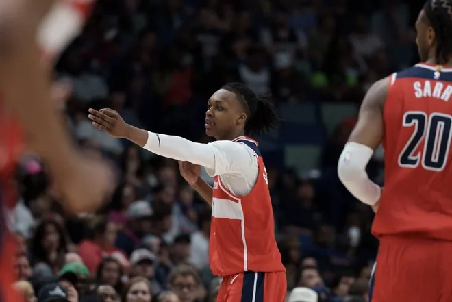 Mar 8, 2026; New Orleans, Louisiana, USA; Washington Wizards guard Bub Carrington (7) reacts after a three-point basket during the first half against the New Orleans Pelicans at Smoothie King Center.