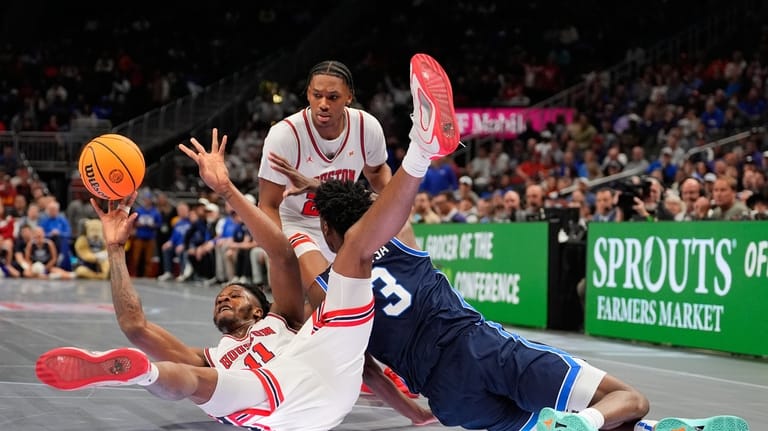 Houston's Joseph Tugler (11) passes as BYU's AJ Dybantsa (3)...
