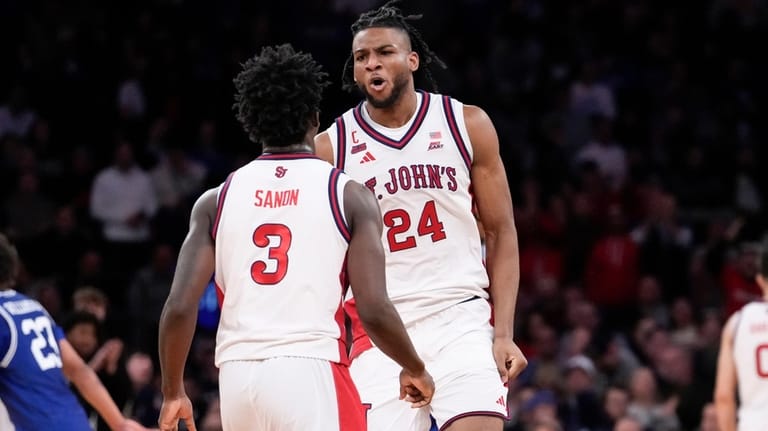 St. John's forward Zuby Ejiofor (24) yells at St. John's...