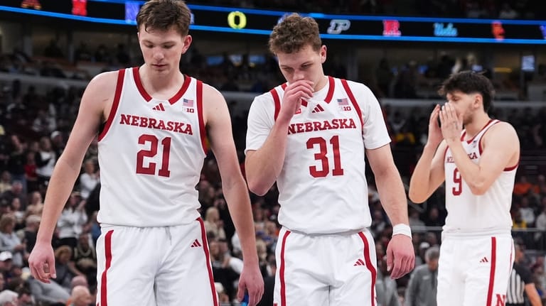 Nebraska forward Pryce Sandfort, left, guard Cale Jacobsen, center, and...