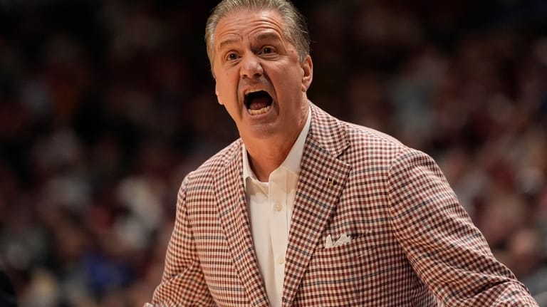Arkansas head coach John Calipari speaks during the first half...