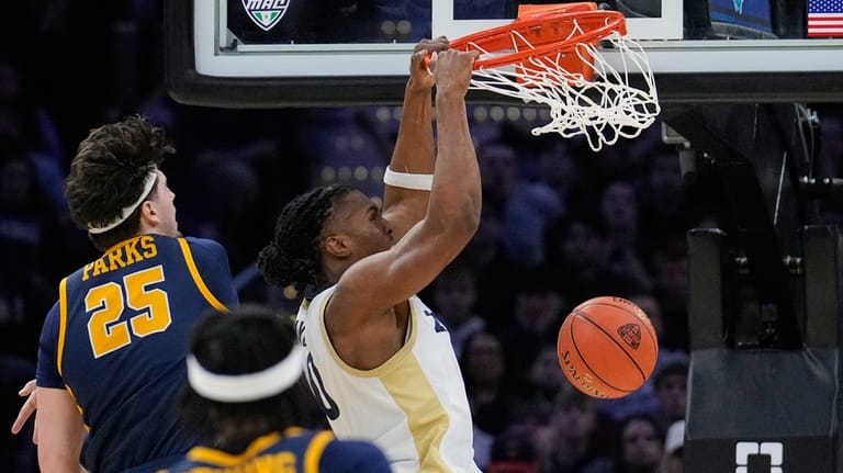 Akron forward Amani Lyles (0) dunks in front of Toledo...
