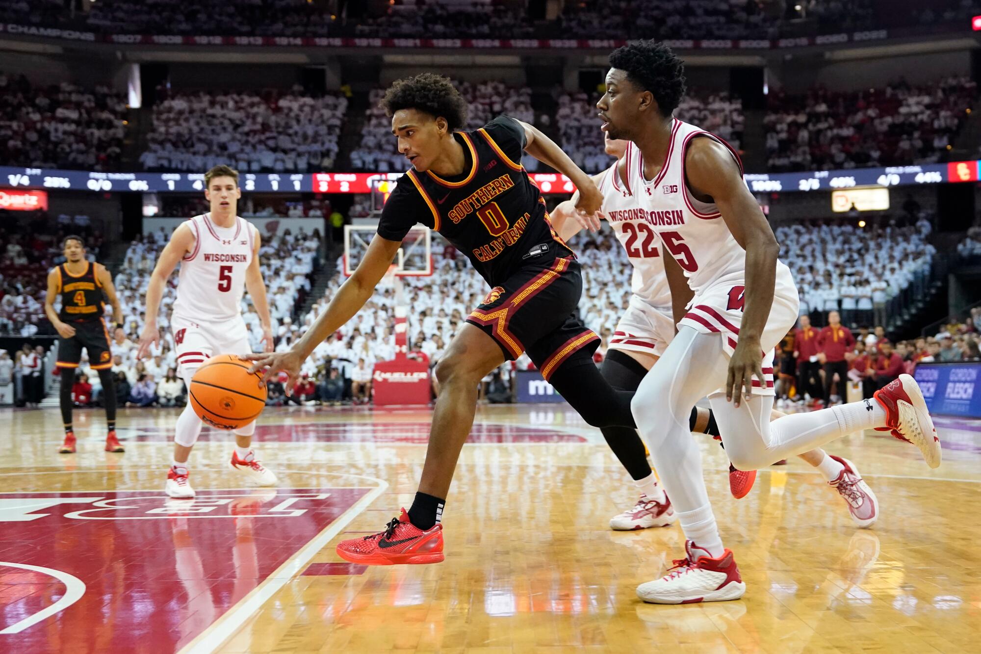 USC guard Alijah Arenas dribbles under pressure from Wisconsin guard John Blackwell on Jan. 25 in Madison, Wis.