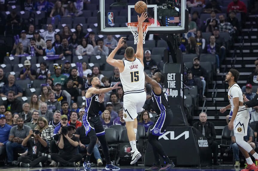 Nikola Jokic #15 of the Denver Nuggets shoots over the Sacramento Kings
